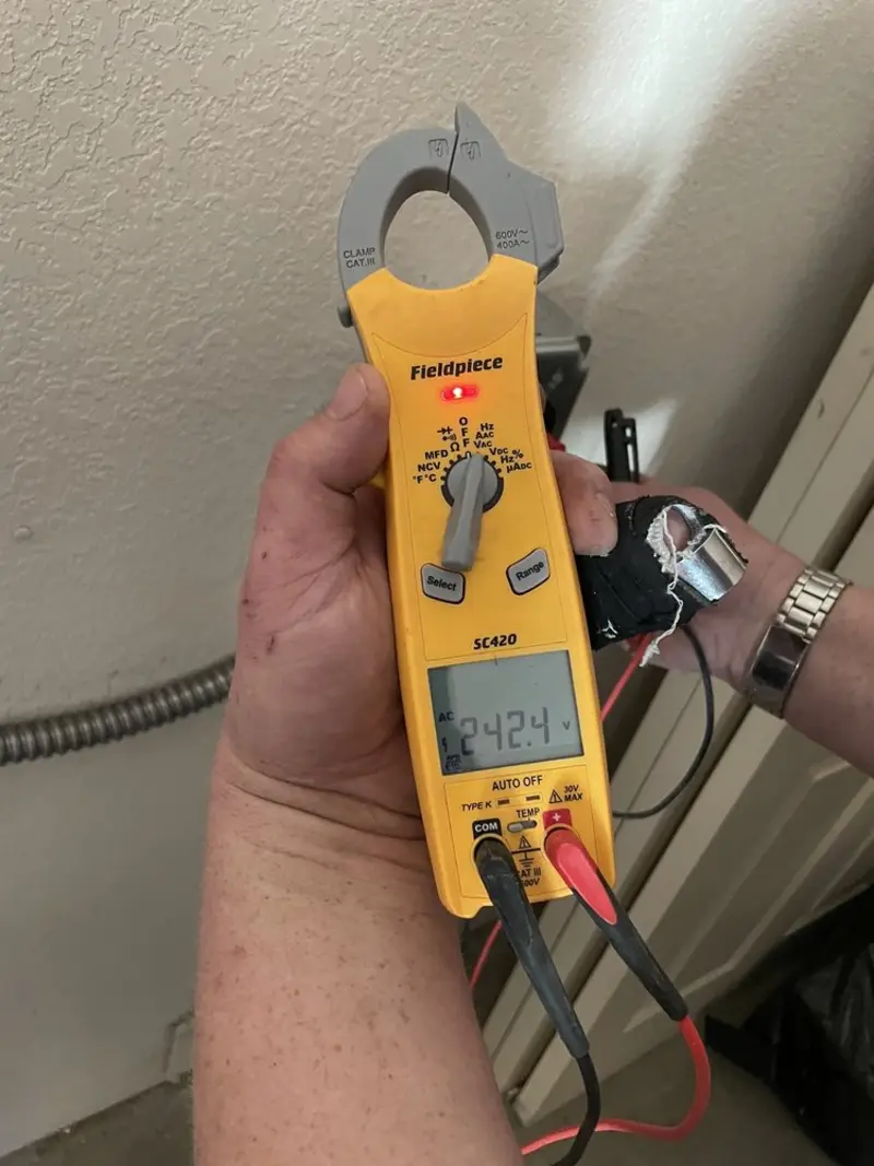 Voltage testing with clamp meter during Whole House Surge Protector in Bernardsville